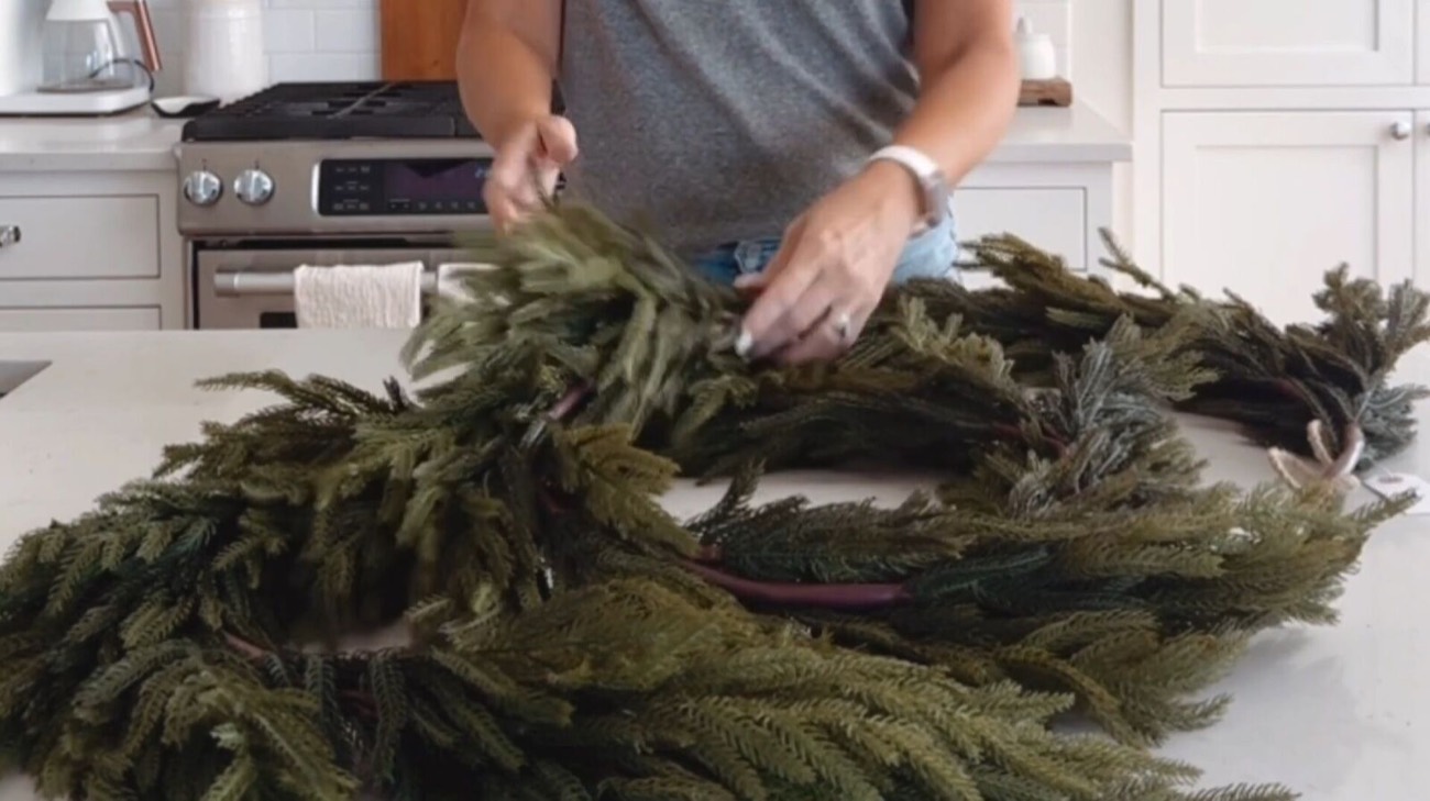 How to Decorate a Christmas Mantel With Lush Garlands